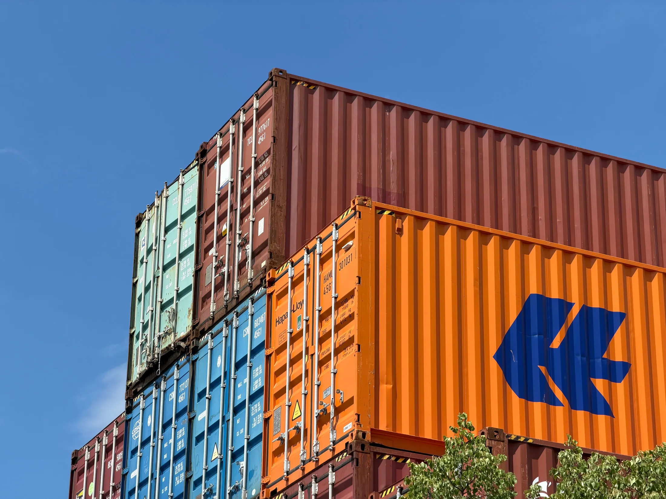 Gantry cranes loading a container ship at a customs terminal at night